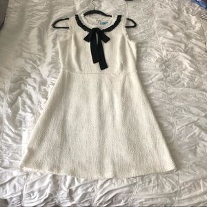 White dress with black ribbon neck tie